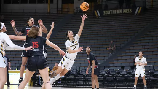 Southern Miss Lady Eagles guard Domonique Davis (2) drives to the basket for a layup in a game between the Southern Miss Golden Eagles and the Arkansas State Red Wolves . January 05, 2023 (Joe Harper/bgnphoto.com)