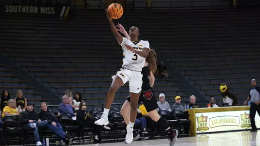 Southern Miss Lady Eagles guard Jacorriah Bracey (3) on a fast break layup in a game between the Southern Miss Golden Eagles and the Arkansas State Red Wolves . January 05, 2023 (Joe Harper/bgnphoto.com)