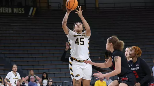 Southern Miss Lady Eagles center Melyia Grayson (45) with a layup after a great assist by Southern Miss Lady Eagles guard Rose Warren (24) in a game between the Southern Miss Golden Eagles and the Arkansas State Red Wolves . January 05, 2023 (Joe Harper/bgnphoto.com)