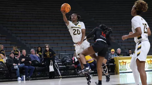 Southern Miss Lady Eagles guard Chardai Watkins (20) drives to the basket in a game between the Southern Miss Golden Eagles and the Arkansas State Red Wolves . January 05, 2023 (Joe Harper/bgnphoto.com)