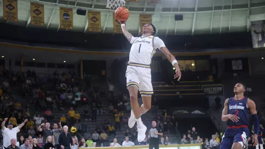 Southern Miss Golden Eagles guard Austin Crowley (1) goes up for a slam dunk in a game between the Southern Miss Golden Eagles and the South Alabama Jaguars . January 19, 2023 (Joe Harper/bgnphoto.com)