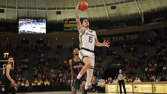 Southern Miss Golden Eagles guard Donovan Ivory (15) drives the lane for a layup in a game between the Southern Miss Golden Eagles and the Arkansas State Red Wolves . January 26, 2023 (Joe Harper/bgnphoto.com)