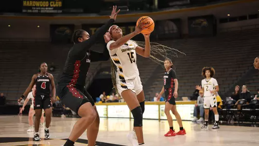 Southern Miss Lady Eagles forward Femi Funeus (15) driving for a layup in a game between the Southern Miss Golden Eagles and the Louisiana Ragin Cajuns . January 05, 2023 (Joe Harper/bgnphoto.com)