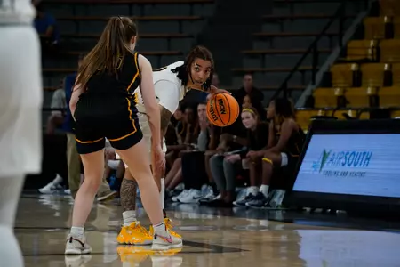 (2) Domonique Davis looks for an opening in the defense