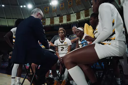 Jack Trosper leads a team huddle during a timeout against Valparaiso