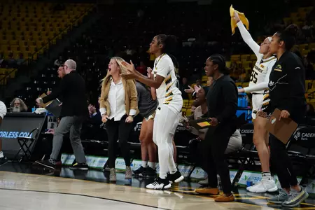 Lady Eagles bench celebrates against Samford