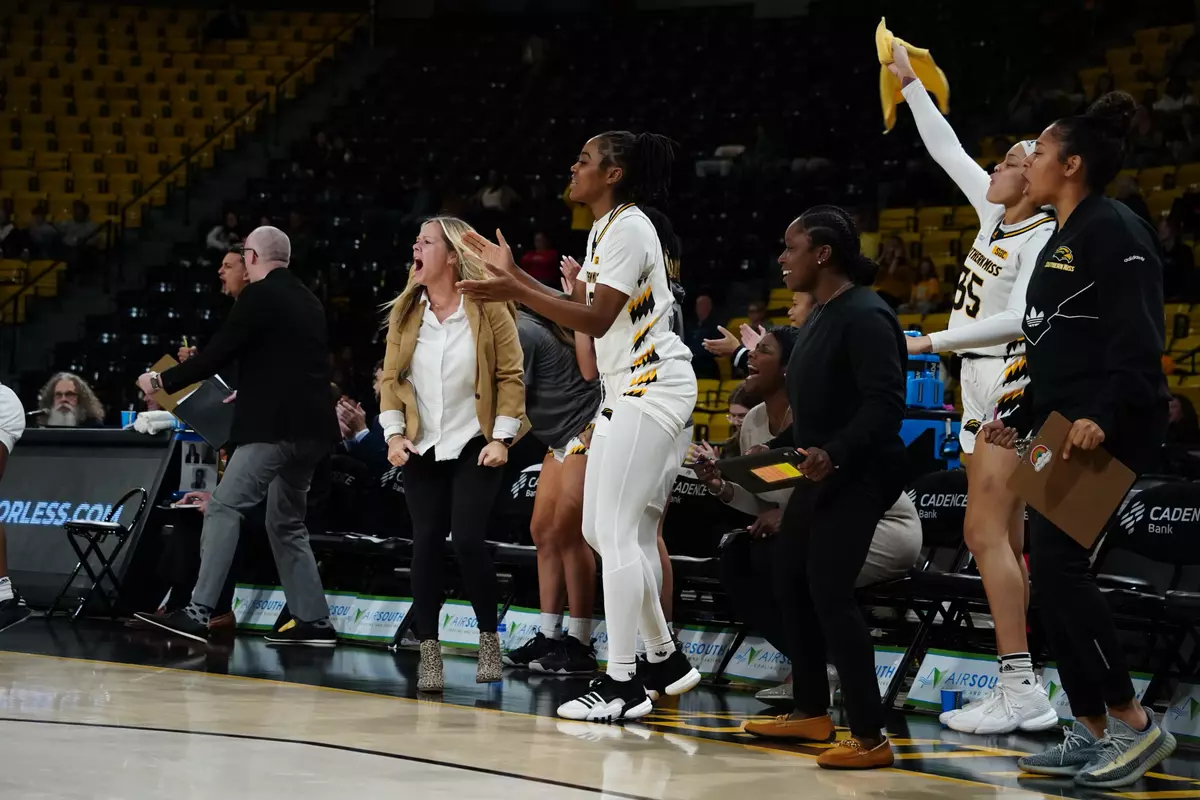 Lady Eagles bench celebrates against Samford