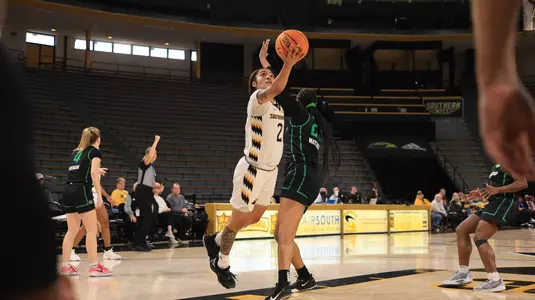 Southern Miss Lady Eagles guard Domonique Davis (2) with a layup in a game between the Southern Miss Golden Eagles and the Marshall Thundering Herd in a NCAA Women's Basketball game. December 30, 2023. (Joe Harper/bgnphoto.com)