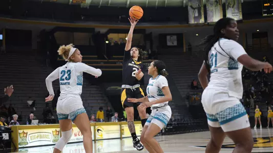 Southern Miss Lady Eagles guard Domonique Davis (2) shots a floater over Coastal Carolina Chanticleers guard Amaya Adams (23) and Coastal Carolina Chanticleers guard Brali Simmons (1) in a game between the Southern Miss Golden Eagles and the Costal Carolina . February 10, 2023 (Joe Harper/bgnphoto.com)