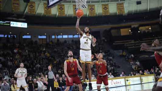 Southern Miss Golden Eagles forward Denijay Harris (4)gets past the Warhawk defenders for a shot in a game between the Southern Miss Golden Eagles and the Louisiana Monroe Warhawks . February 10, 2023 (Joe Harper/bgnphoto.com)