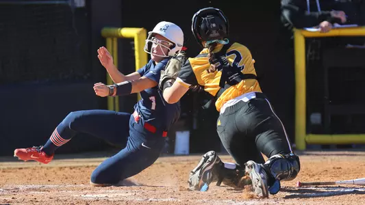 Southern Miss Golden Eagles catcher Hannah Borden (32) puts a tag on the Samford base runner in a game between the Southern Miss Golden Eagles and the Samford Bulldogs February 11, 2023 (Joe Harper/bgnphoto.com)