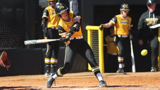Southern Miss Golden Eagles catcher Hannah Borden (32) puts the ball in play in a game between the Southern Miss Golden Eagles and the Samford Bulldogs February 11, 2023 (Joe Harper/bgnphoto.com)