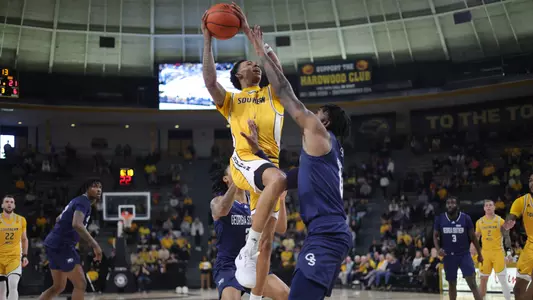 Southern Miss Golden Eagles guard Austin Crowley (1) going up strong to the hoop in a game between the Southern Miss Golden Eagles and the Georgia Southern Eagles . February 18, 2023 (Joe Harper/bgnphoto.com)