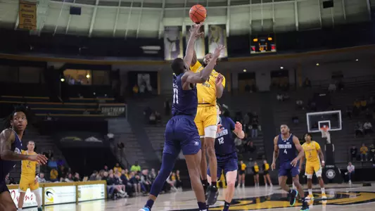 Southern Miss Golden Eagles forward Denijay Harris (4) takes a shot over Georgia Southern Eagles forward Johnny McFatten (11) in a game between the Southern Miss Golden Eagles and the Georgia Southern Eagles . February 18, 2023 (Joe Harper/bgnphoto.com)