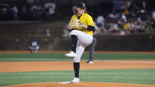 Southern Miss. pitcher Billy Oldham (21) in his wind up in a game between the Southern Miss Golden Eagles and the New Orleans Privateers. February 19, 2023 (Joe Harper/bgnphoto.com)