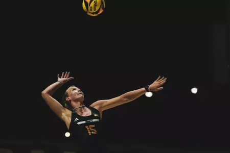 Vanessa Hurnikova mid-serve