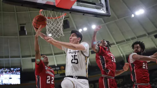 Southern Miss Golden Eagles guard Marcelo Perez (25) shoots a reverse layup in a game between the Southern Miss Golden Eagles and the Louisiana Ragin Cajuns . February 9, 2023 (Joe Harper/bgnphoto.com)