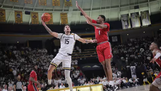 Southern Miss Golden Eagles guard Donovan Ivory (15) goes up for a lay up over Louisiana Lafayette Ragin Cajuns forward Joe Charles (1) in a game between the Southern Miss Golden Eagles and the Louisiana Ragin Cajuns . February 9, 2023 (Joe Harper/bgnphoto.com)