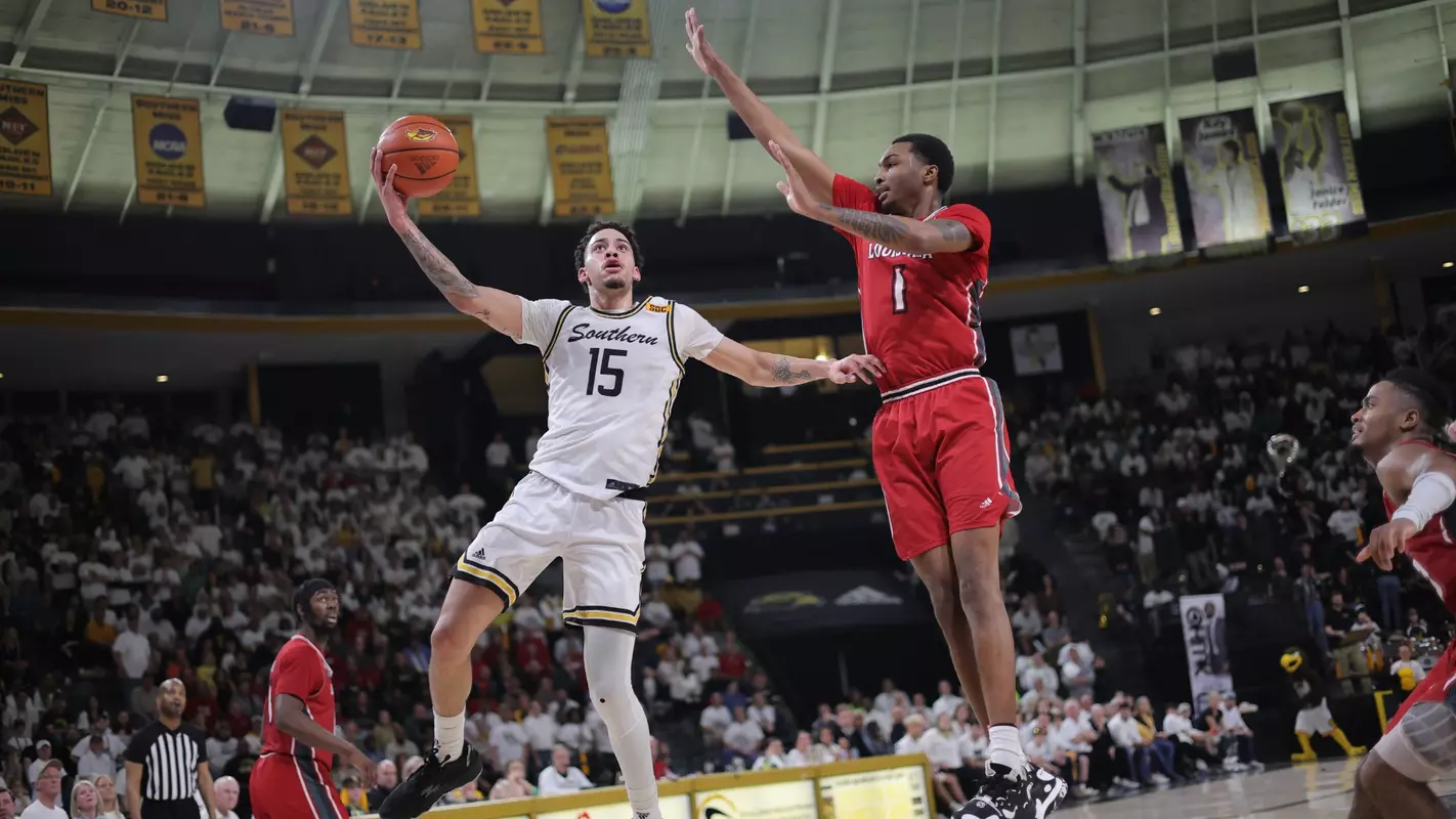 Southern Miss Golden Eagles guard Donovan Ivory (15) goes up for a lay up over Louisiana Lafayette Ragin Cajuns forward Joe Charles (1) in a game between the Southern Miss Golden Eagles and the Louisiana Ragin Cajuns . February 9, 2023 (Joe Harper/bgnphoto.com)