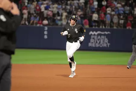 (37) Carson Paetow enjoys a home run trot against Ole Miss