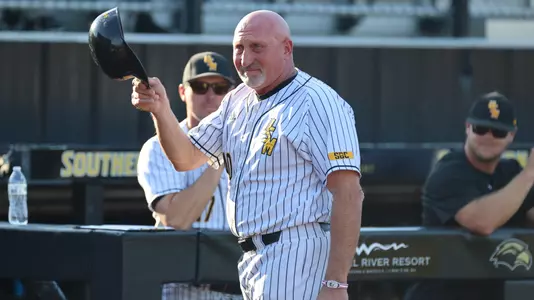 Southern Miss Head Coach Scott Berry being congratulated on his 500th win in a game between the Southern Miss Golden Eagles and James Madison Dukes. April 14, 2023 (Joe Harper/bgnphoto.com)