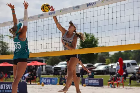 (13) Hallie Phelan at the Net Against Coastal Carolina in the Sun Belt Tournament