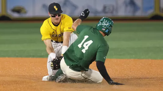 Southern Miss. pitcher\infield Nick Monistere (8) tags out Tulane infielder Simon Baumgardt (14) as he tries to steal second base in a game between the Southern Miss Golden Eagles and Tulane Green Wave. May 02, 2023 (Joe Harper/bgnphoto.com)