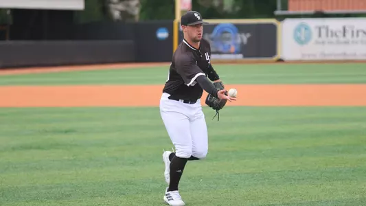 Southern Miss. pitcher Niko Mazza (23) tosses the the ball to first base to record the out in a game between the Southern Miss Golden Eagles and South Alabama. May 07, 2023 (Joe Harper/bgnphoto.com)