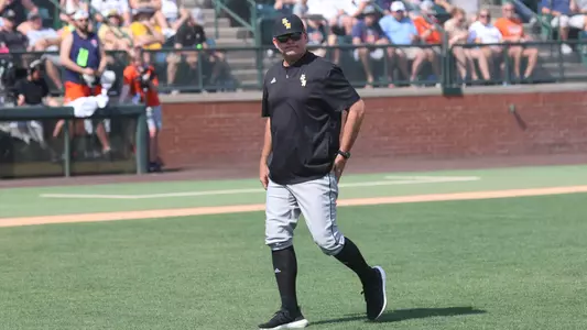 Southern Miss. pitching coach Christian Ostrander heads back from the ptiching mound in a game between the Southern Miss Golden Eagles and Auburn Tigers. June 03, 2023 (Joe Harper/bgnphoto.com)