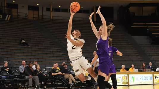 Southern Miss Lady Eagles guard Domonique Davis (2) with an acrobatic layup in a game between the Southern Miss Golden Eagles and the James Madison Dukes in a NCAA Women's Basketball game. January 11, 2024. (Joe Harper/bgnphoto.com)