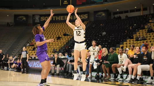 Southern Miss Lady Eagles guard Morgan Sieper (12) with a three point shot in a game between the Southern Miss Golden Eagles and the James Madison Dukes in a NCAA Women's Basketball game. January 11, 2024. (Joe Harper/bgnphoto.com)
