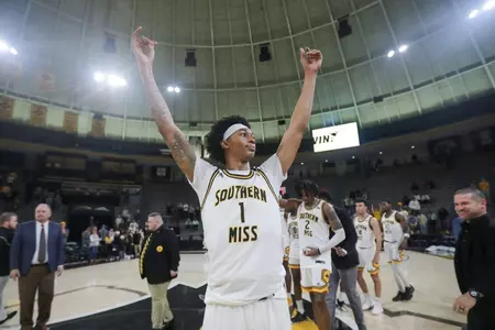 Austin Crowley raises his arms to celebrate the win over No. 19 James Madison