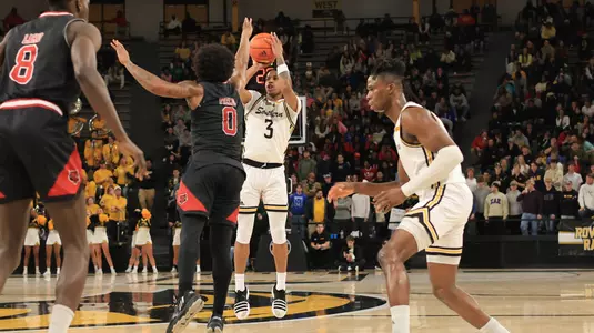 Southern Miss Golden Eagles guard Mo Arnold (3) shoots a three point shot in a game between the Southern Miss Golden Eagles and the Arkansas State Red Wolves in a NCAA Men's Basketball game. January 11, 2024. (Joe Harper/bgnphoto.com)