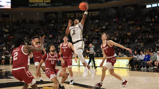 Southern Miss Golden Eagles guard Mo Arnold (3) goes up strong for a layup in a game between the Southern Miss Golden Eagles and the Troy Trojans in a NCAA Men's Basketball game. January 20, 2024. (Joe Harper/bgnphoto.com)