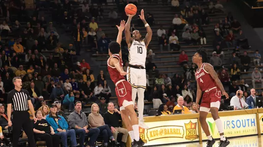 Southern Miss Golden Eagles guard Cobie Montgomery (10) with a three point shot in a game between the Southern Miss Golden Eagles and the Troy Trojans in a NCAA Men's Basketball game. January 20, 2024. (Joe Harper/bgnphoto.com)