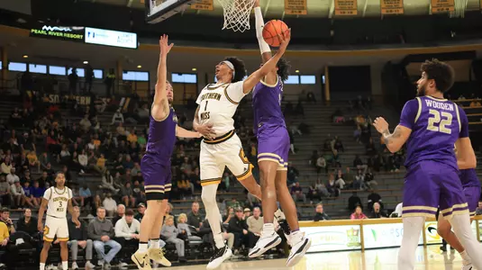 Southern Miss Golden Eagles guard Austin Crowley (1) driving the lane for a layup in a game between the Southern Miss Golden Eagles and the James Madison Dukes in a NCAA Women's Basketball game. January 01, 2024. (Joe Harper/bgnphoto.com)