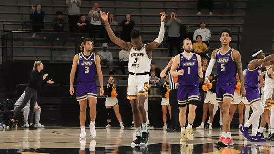 Southern Miss Golden Eagles forward Victor Iwuakor (0) calling for the fans to get loud and the clock ticks down ans the Golden Eagles upset the James Madison Dukes in a game between the Southern Miss Golden Eagles and the James Madison Dukes in a NCAA Women's Basketball game. January 01, 2024. (Joe Harper/bgnphoto.com)
