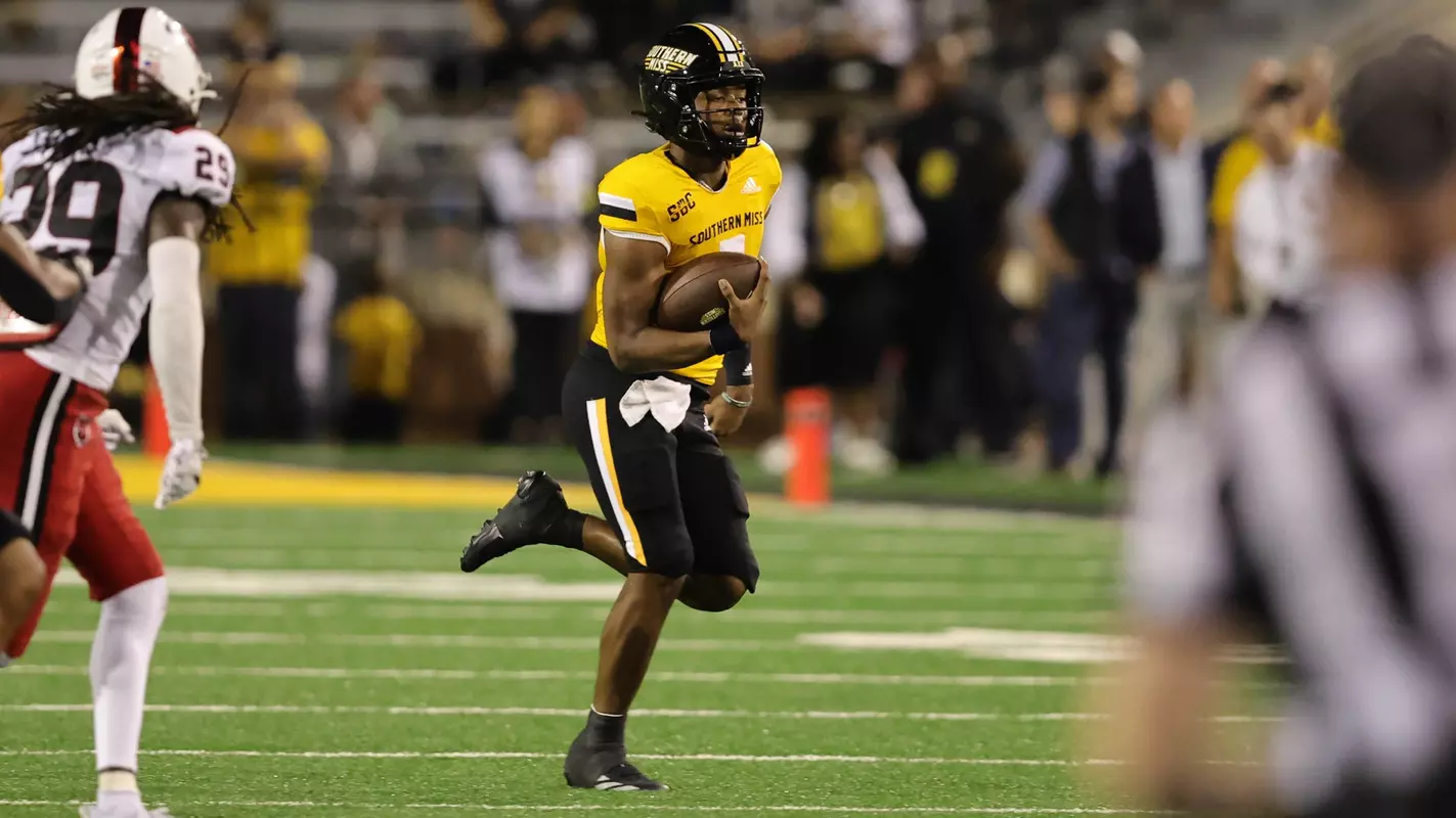 Southern Miss Golden Eagles quarterback Ethan Crawford (3) runs around the outside of the formation in a NCAA football game between the Southern Miss Golden Eagles and the Arkansas State Red Wolves. October 19, 2024. (Joe Harper/bgnphoto.com)