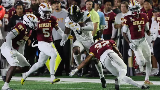 Southern Miss Golden Eagles running back Rodrigues Clark (0) jumps over the Texas defender In a game between the Southern Miss Golden Eagles and the Texas State Bobcats in a NCAA football game. November 16, 2024 (Joe Harper/bgnphoto.com)