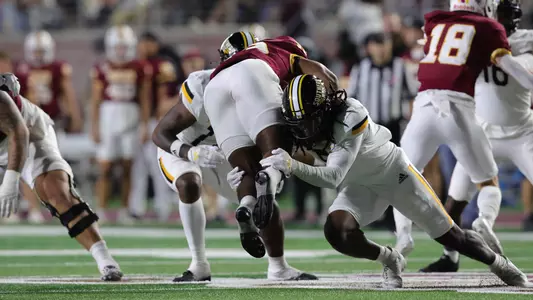 Southern Miss Golden Eagles safety Jay Jones (5) tackles Texas State Bobcats running back Deion Hankins (33) In a game between the Southern Miss Golden Eagles and the Texas State Bobcats in a NCAA football game. November 16, 2024 (Joe Harper/bgnphoto.com)