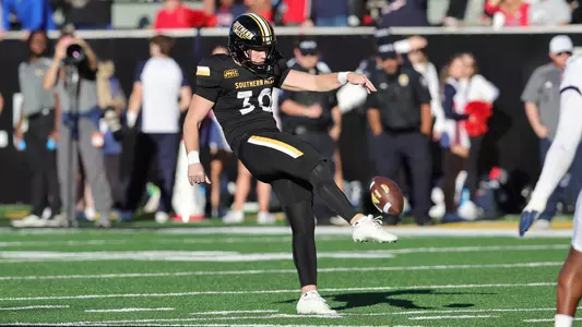 Southern Miss Golden Eagles punter Bryce Lofton (30) with a punt In a game between the Southern Miss Golden Eagles and the South Alabama Jaguars in a NCAA football game. November 23, 2024 (Joe Harper/bgnphoto.com)
