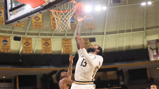 Southern Miss Golden Eagles forward Denijay Harris (13) with a layup In a game between the Southern Miss Golden Eagles and the William Carey Crusaders in a NCAA Men’s basketball game. December 30, 2024 (Joe Harper/bgnphoto.com)