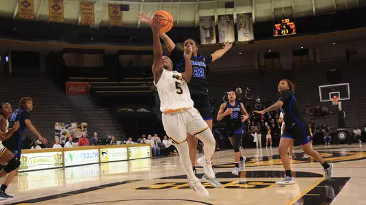 Southern Miss Lady Eagles guard Bre Sutton (5) takes a shot after getting past Memphis Tigers forward Layken Cox (22) In a game between the Southern Miss Golden Eagles and the Memphis Tigers in a NCAA Women’s basketball game. December 08, 2024 (Joe Harper/bgnphoto.com)