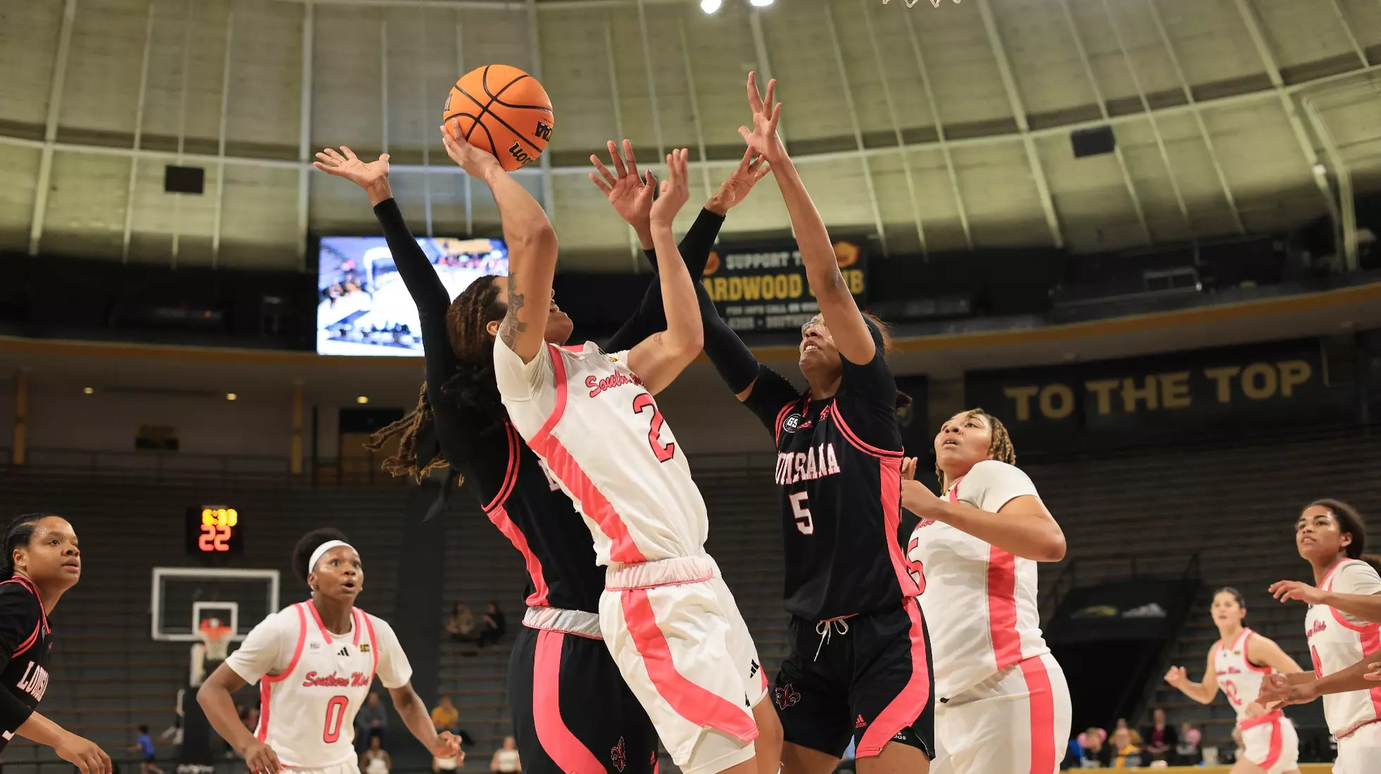 Southern Miss Lady Eagles guard Domonique Davis (2) takes a shot over Louisiana Ragin' Cajuns forward Tamera Johnson (5) in a game between the Southern Miss Golden Eagles and the Louisiana Ragin Cajuns in a NCAA Women's Basketball game. February 01, 2024. (Joe Harper/bgnphoto.com)