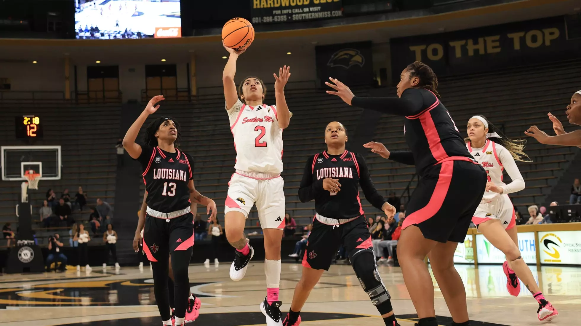 Southern Miss Lady Eagles guard Domonique Davis (2) drives the lane for a layup in a game between the Southern Miss Golden Eagles and the Louisiana Ragin Cajuns in a NCAA Women's Basketball game. February 01, 2024. (Joe Harper/bgnphoto.com)