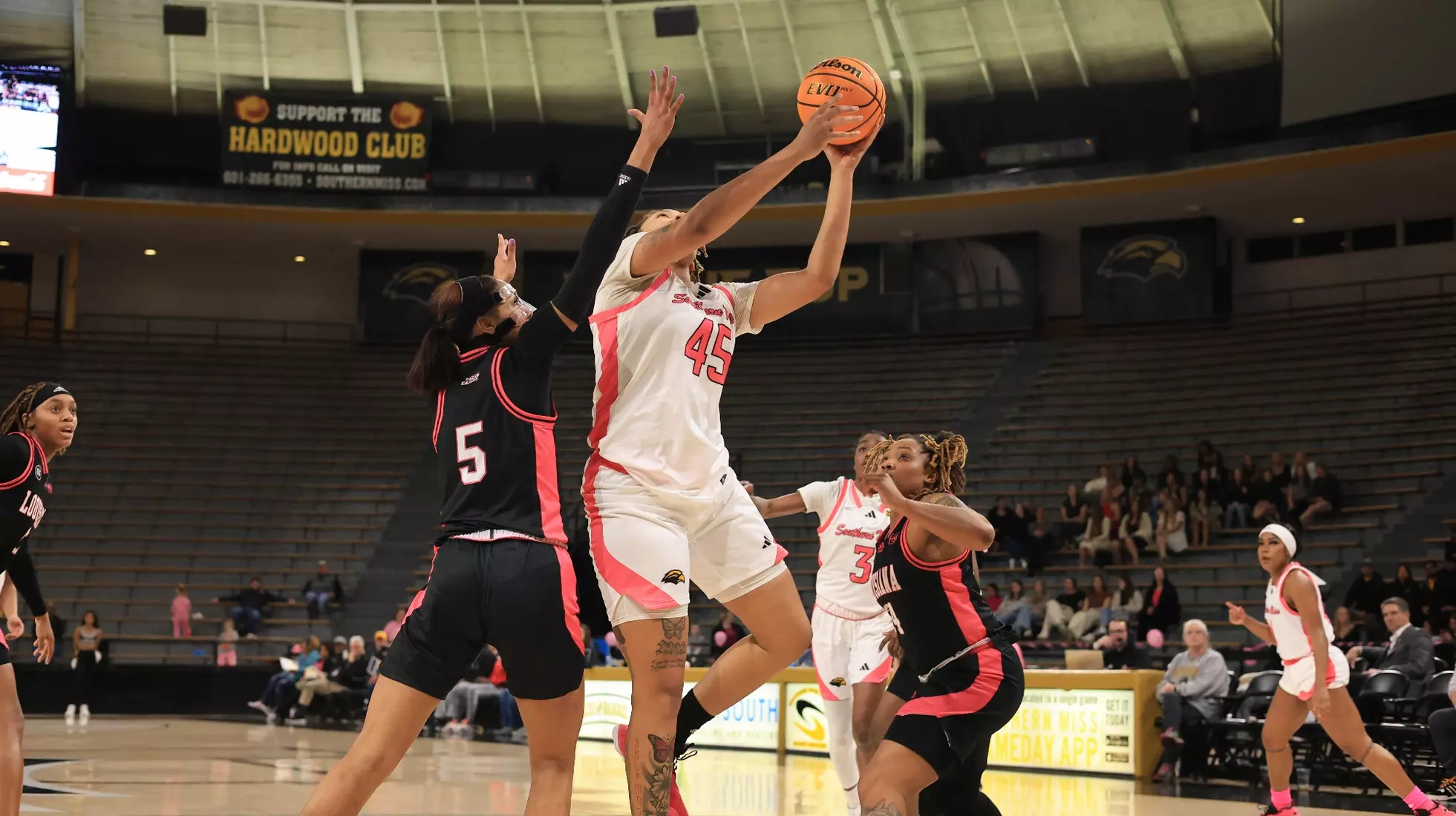 Southern Miss Lady Eagles center Melyia Grayson (45) with a layup over Louisiana Ragin' Cajuns forward Tamera Johnson (5) in a game between the Southern Miss Golden Eagles and the Louisiana Ragin Cajuns in a NCAA Women's Basketball game. February 01, 2024. (Joe Harper/bgnphoto.com)