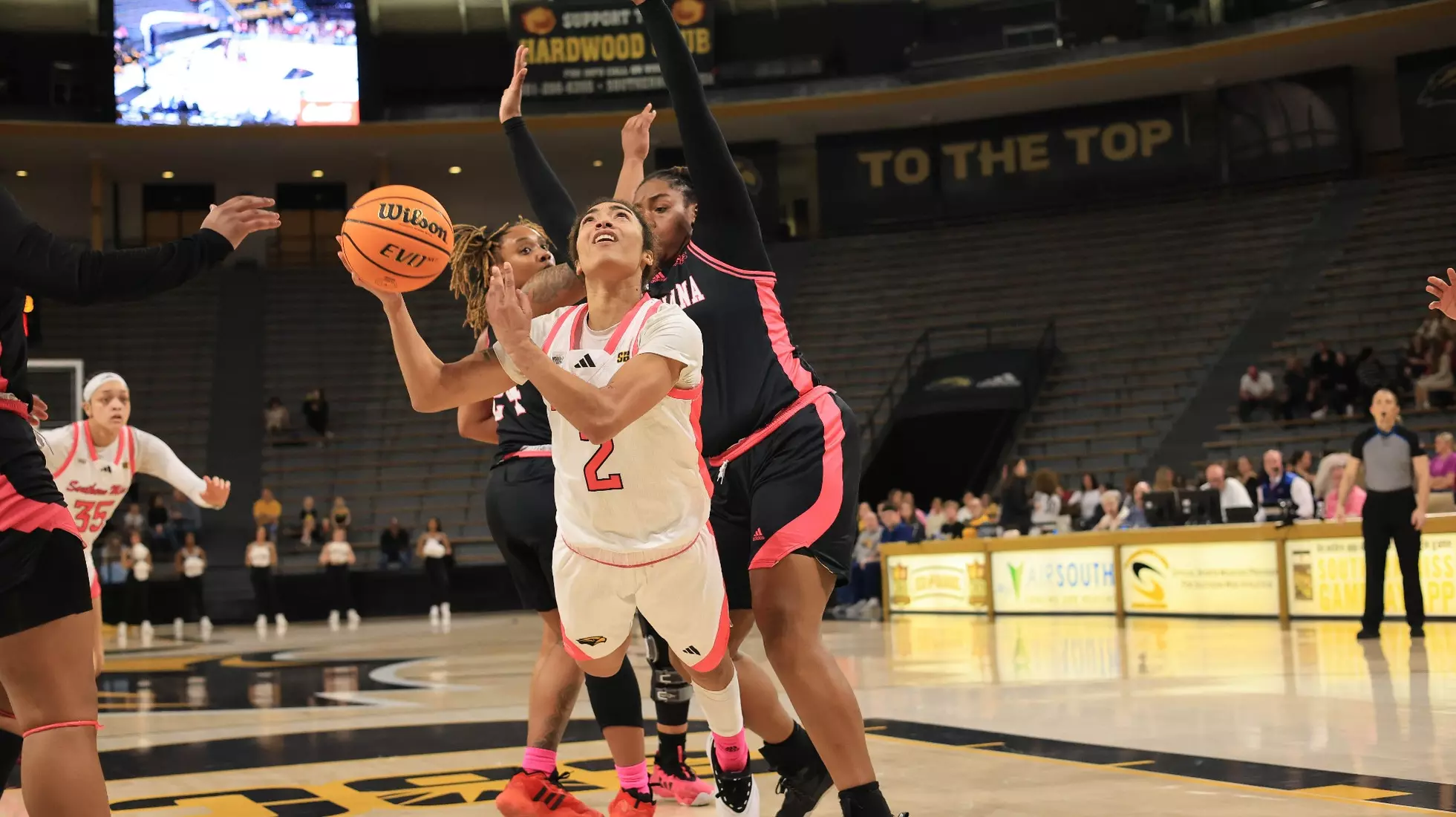 Southern Miss Lady Eagles guard Domonique Davis (2) with an acrobatic shot in a game between the Southern Miss Golden Eagles and the Louisiana Ragin Cajuns in a NCAA Women's Basketball game. February 01, 2024. (Joe Harper/bgnphoto.com)