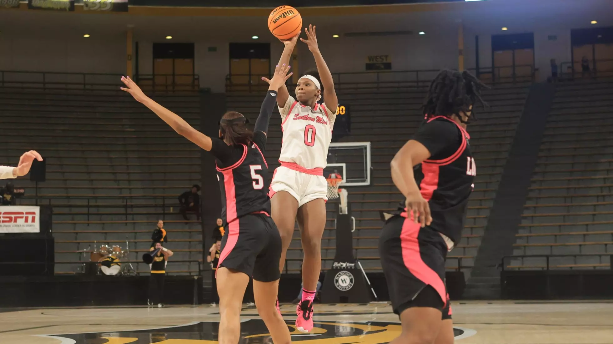 Southern Miss Lady Eagles guard Brikayla Gray (0) with a shot over Louisiana Ragin' Cajuns forward Tamera Johnson (5) from the top of the key in a game between the Southern Miss Golden Eagles and the Louisiana Ragin Cajuns in a NCAA Women's Basketball game. February 01, 2024. (Joe Harper/bgnphoto.com)