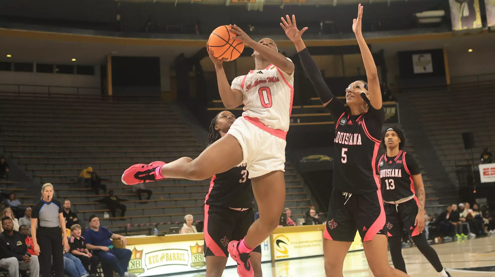 Southern Miss Lady Eagles guard Brikayla Gray (0) goes up after getting past Louisiana Ragin' Cajuns forward Tamera Johnson (5) in a game between the Southern Miss Golden Eagles and the Louisiana Ragin Cajuns in a NCAA Women's Basketball game. February 01, 2024. (Joe Harper/bgnphoto.com)