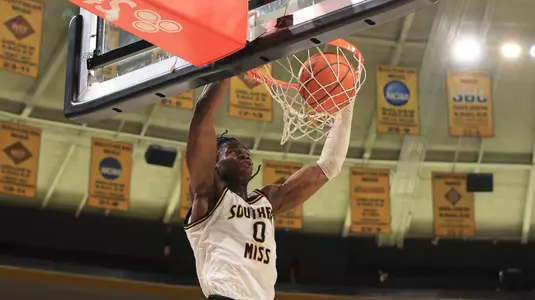 Southern Miss Golden Eagles forward Victor Iwuakor (0) with a dunk in a game between the Southern Miss Golden Eagles and the Western Michigan Broncos in a NCAA Men's Basketball game. February 10, 2024. (Joe Harper/bgnphoto.com)